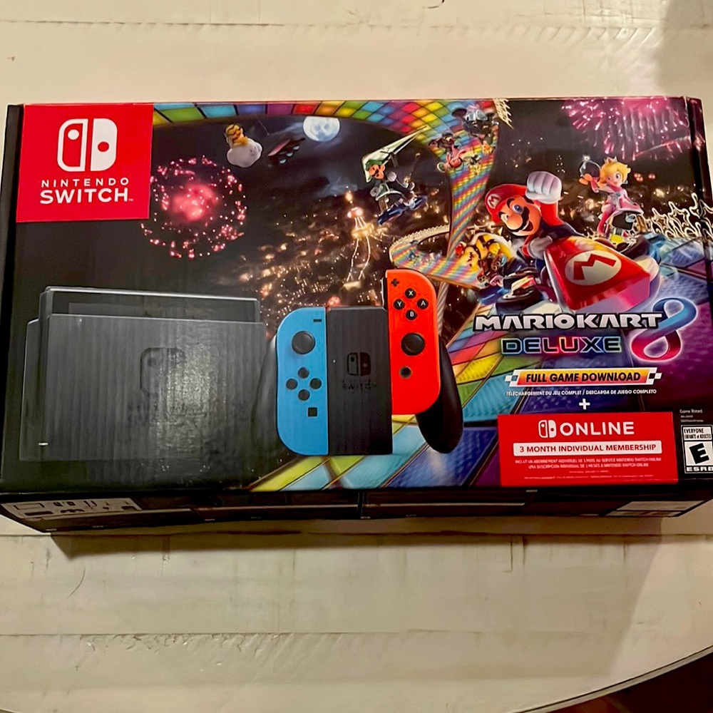 Nintendo switch Mario Kart console and 3 games